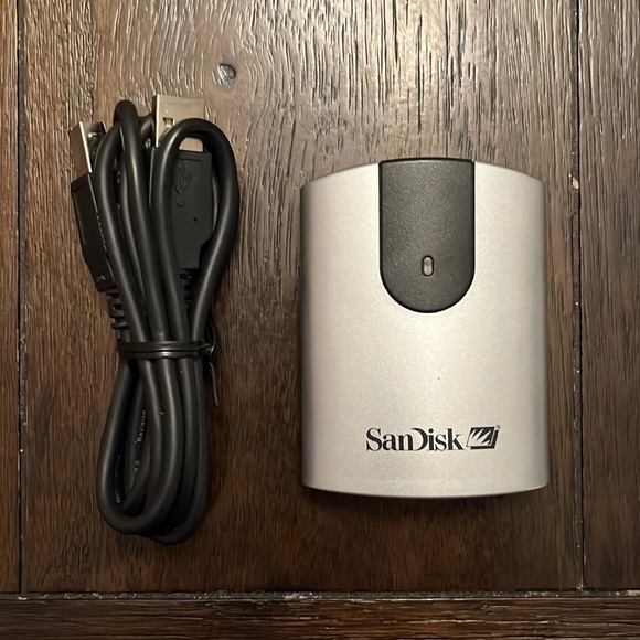 SanDisk Reader for downloading data onto computer. Just insert SanDisk card.